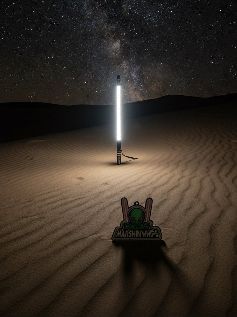 360 camera mount glowing white in the sand